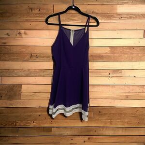 Purple skinny strap mini dress with mesh detail.